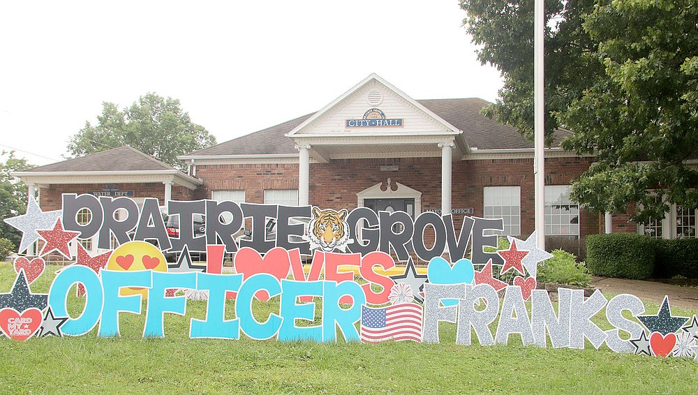 LYNN KUTTER ENTERPRISE-LEADER
This life-size sign was placed in front of Prairie Grove City Hall for the "Welcome Home" parade for Officer Tyler Franks. He was released from a rehabilitation center on June 2 and returned home to continue his recovery.