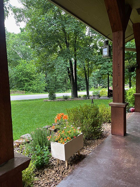 Photo submitted They both take great pride in their yard and have a lovely front approach.