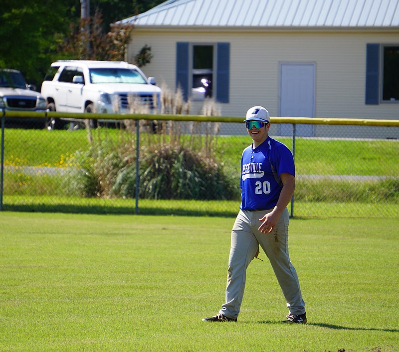 Brock Mayr smiles in warmups before the start of an inning in left field. The Jessieville freshman contributes at pitcher, first base and in the outfield. The Sentinel-Record/Krishnan Collins