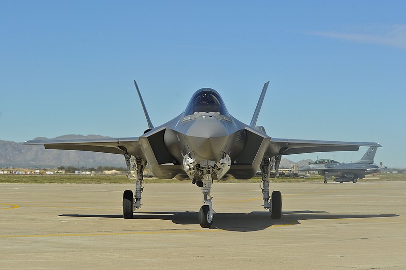 The F-35 Lightning II makes its first appearance March 10, 2014, at Luke Air Force Base. The aircraft was flown in directly from the Lockheed Martin factory at Fort Worth, Texas, and is the first of 144 F-35s that will eventually be assigned to the base. (U.S. Air Force photo/Staff Sgt. Darlene Seltmann)