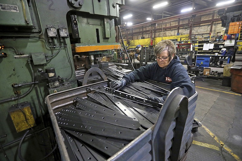 FILE - In this Thursday, April 22, 2021 file photo, Marie Tibbott sorts product at EIP Manufacturing in Earlville, Iowa. Growth in U.S. manufacturing picked up in May, even as supply chain problems persist and businesses continue to struggle to find workers. The Institute for Supply Management, a trade group of purchasing managers, said Tuesday, June 1 that its index of manufacturing activity rose in May to a reading of 61.2 from 60.7 in April. (Jessica Reilly/Telegraph Herald via AP, File)