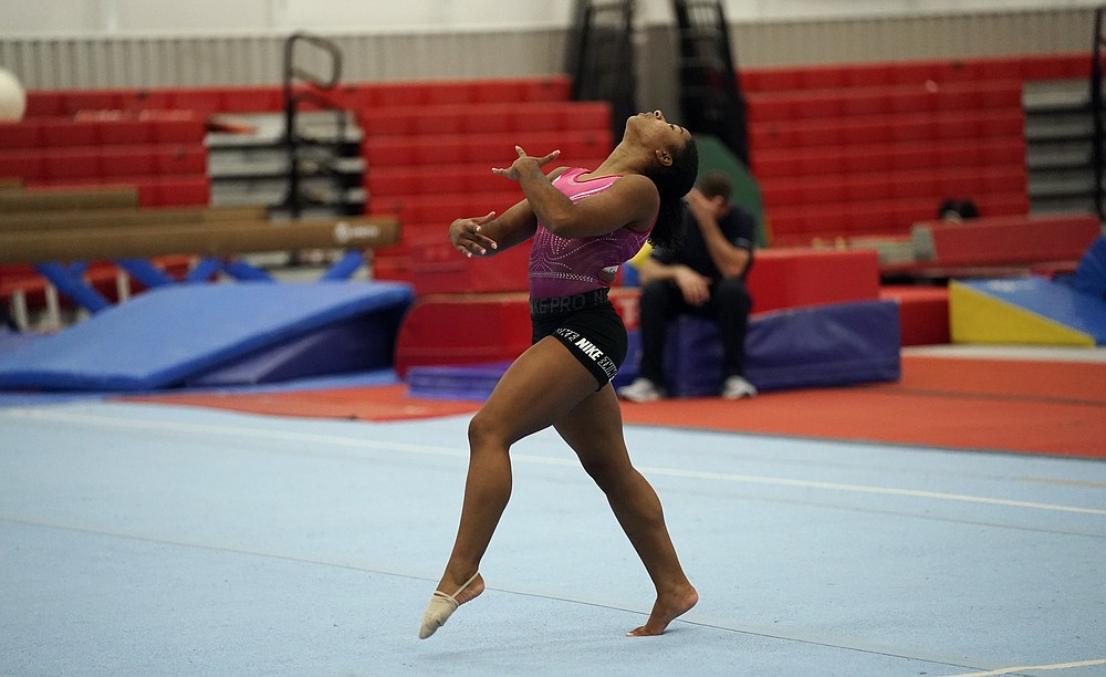 FILE - In this May 11, 2021, file photo, gymnast Jordan Chiles practices her floor routine in Spring, Texas. The 20-year-old Chiles will compete at the U.S. Championships this weekend hoping to build off a strong performance at the U.S. Classic, where she finished second to Olympic and world champion Simone Biles. (AP Photo/David J. Phillip, File)