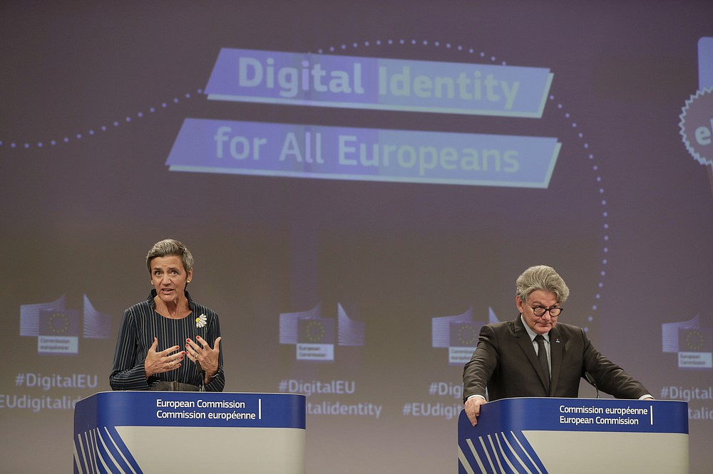 European Commissioner for Europe fit for the Digital Age Margrethe Vestager, left, and European Commissioner for Internal Market Thierry Breton participate in a media conference at EU headquarters in Brussels, Thursday, June 3, 2021. The European Union unveiled plans Thursday for a digital ID wallet that residents can use to access services across the bloc, in an effort to accelerate the shift to online for its post-pandemic recovery strategy. (Stephanie Lecocq, Pool via AP)