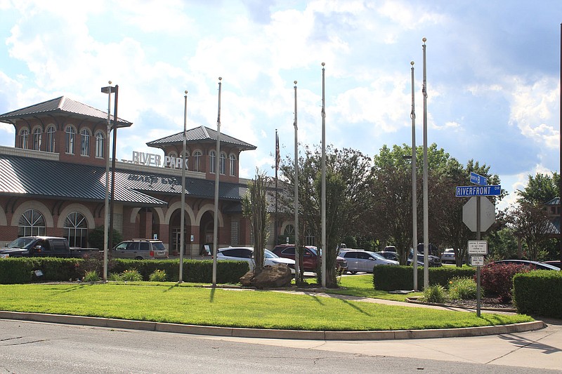 The empty flagpoles at Fort Smith's Riverfront Park are seen Thursday, June 3, 2021, after the removal of the seven historic flags that have flown over the city. (NWA Democrat-Gazette file photo)