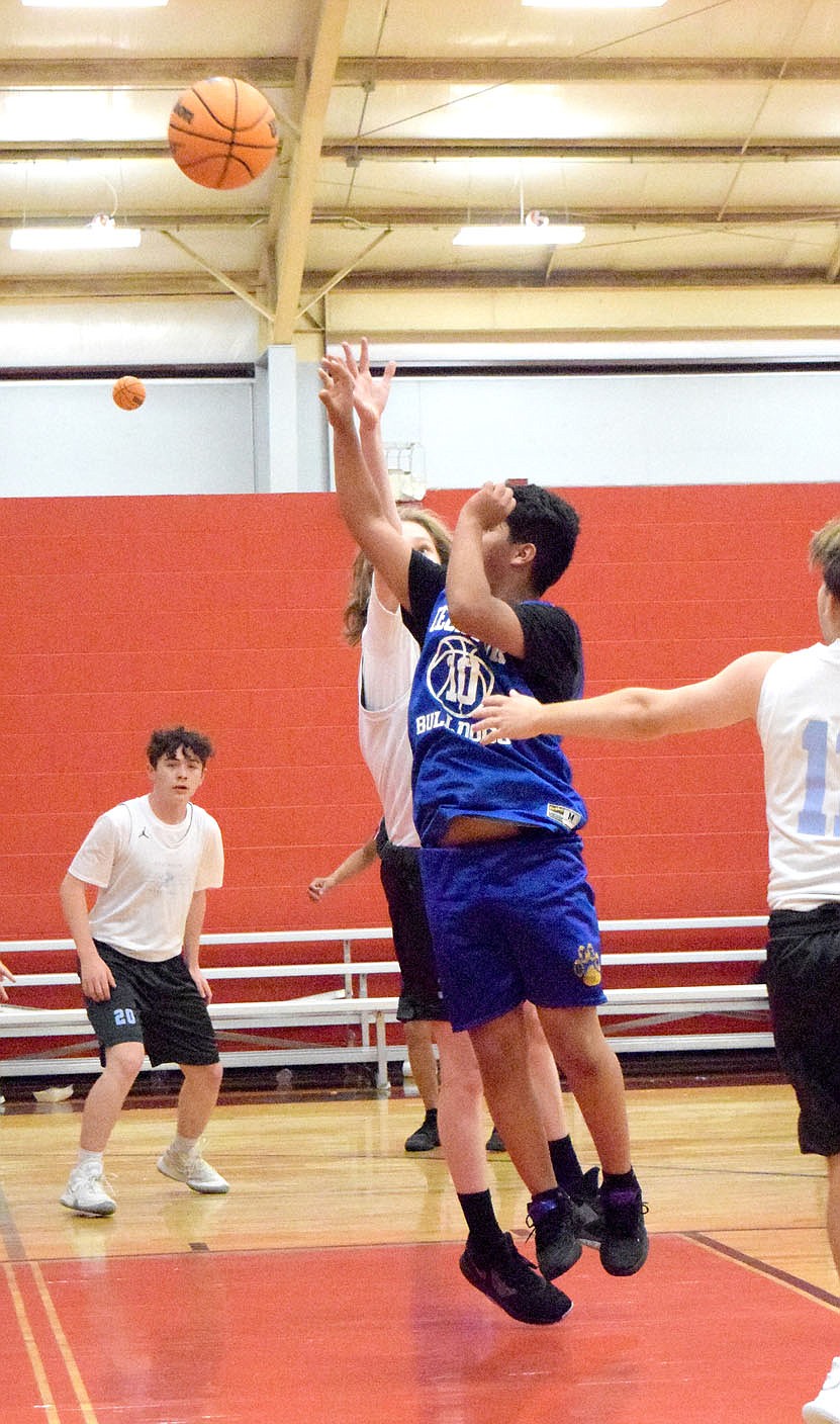 Westside Eagle Observer/MIKE ECKELS
Brandon Cruz launches a jumper from inside the lane during the June 8 Decatur-Fort Smith Southside junior high basketball contest at the Arkansas Athletics Outreach gym in Fayetteville. The Mavericks took the team camp contest 26-4 over the Bulldogs.