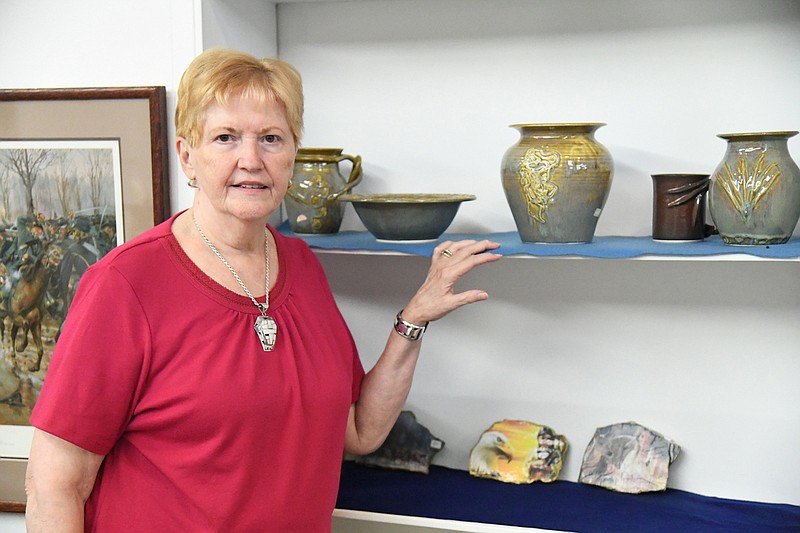 Ann Gilbert stands in American Art Gallery. - Photo by Tanner Newton of The Sentinel-Record