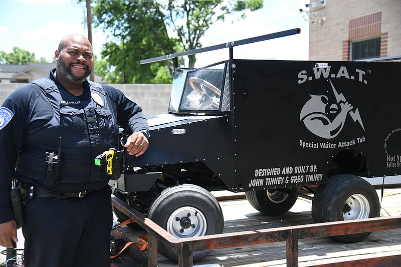 Hot Springs police Cpl. Patrick Langley shows the Hot Spring Police Department’s race tub. The department hopes to repeat its win in 2019. - Photo by Tanner Newton of The Sentinel-Record