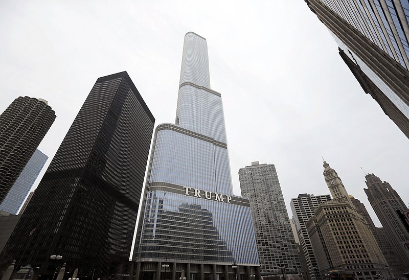 This March 10, 2016, file photo shows the Trump International Hotel and Tower in Chicago. During the four years of Donald Trump's presidency, prices for condos in the building have dropped, down 34%, according to Gail Lissner, a managing director of consultancy Integra Realty Resources. That compares to a 6% drop in the same period for 65 other condo buildings downtown. - AP Photo/Charles Rex Arbogast