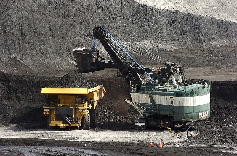 FILE - In this April 4, 2013, file photo, a mechanized shovel loads a haul truck that can carry up to 250 tons of coal at the Spring Creek coal mine near Decker, Mont. On Thursday, June 3, 2021, a U.S. judge has rejected the Biden administration's attempt to delay a lawsuit from several states and environmentalists who are seeking to end lease sales for coal mining on federal lands. (AP Photo/Matthew Brown, File)