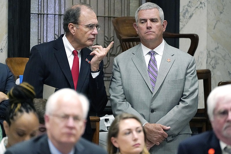 Republican Lt. Gov. Delbert Hosemann, left, confers with House Speaker Philip Gunn, R-Clinton, during a hearing on medical marijuana before the Senate Public Health and Welfare Committee at the Capitol in Jackson, Miss., Thursday, June 3, 2021. (AP Photo/Rogelio V. Solis)