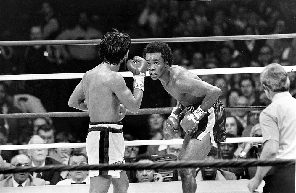 FILE - In this Nov. 25, 1980 file photo, Sugar Ray Leonard, right, taunts at Roberto Duran in the ring during a WBC Welterweight Championship fight refereed by Octavio Meyran in New Orleans, La. Sugar Ray Leonard, Roberto Duran, Thomas Hearns and Marvelous Marvin Hagler delivered when it mattered, and two of the fights are considered to be among the greatest ever. A four-hour documentary, "The Kings" explores the magical decade. (AP Photo, File)