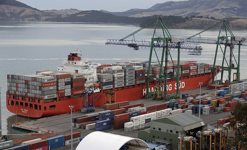 FILE - In this June 3, 2020, file photo, containers are loaded onto a ship for export at Lyttelton Port near Christchurch, New Zealand. Trade ministers from the Pacific rim were discussing ways to build back better from the pandemic in an online meeting Saturday, June 5, 2021, hosted by New Zealand. (AP Photo/Mark Baker, File)