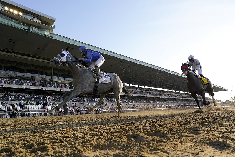 Essential Quality (2), with jockey Luis Saez up, crosses the finish line ahead of Hot Rod Charlie (4), with jockey Flavien Prat up, to win the 153rd running of the Belmont Stakes horse race, Saturday, June 5, 2021, At Belmont Park in Elmont, N.Y. (AP Photo/Seth Wenig)
