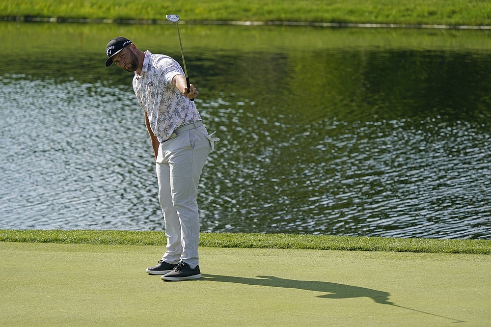 Jon Rahm reacts to a birdie putt on the 16th green during the third round of the Memorial golf tournament, Saturday, June 5, 2021, in Dublin, Ohio. (AP Photo/Darron Cummings)