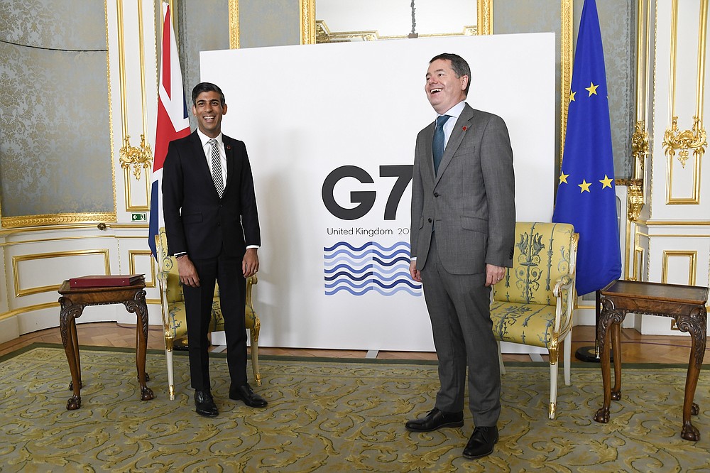 Britain's Chancellor of the Exchequer Rishi Sunak, left, poses for photos with Eurogroup President Paschal Donohoe as finance ministers from across the G7 nations meet at Lancaster House in London, Saturday, June 5, 2021 ahead of the G7 leaders' summit. (AP Photo/Alberto Pezzali, Pool)