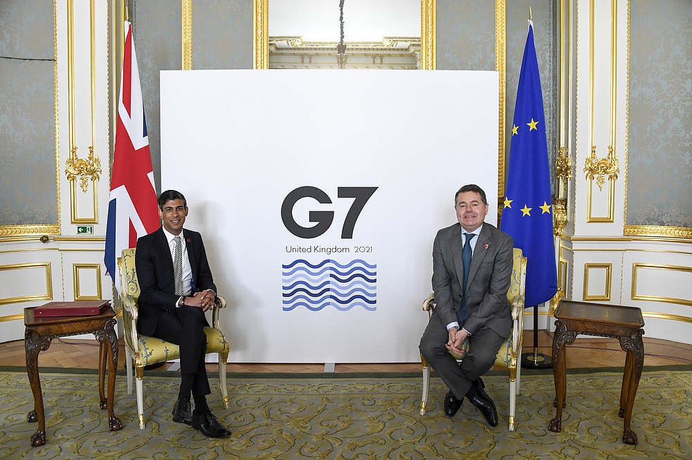 Britain's Chancellor of the Exchequer Rishi Sunak, left, poses for photos with Eurogroup President Paschal Donohoe as finance ministers from across the G7 nations meet at Lancaster House in London, Saturday, June 5, 2021, ahead of the G7 leaders' summit. (AP Photo/Alberto Pezzali, Pool)