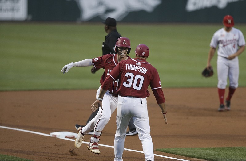 Arkansas infielder Matt Goodheart (10) runs home for a score Saturday during the first inning in the second game of the NCAA Fayetteville Regional at Baum-Walker Stadium in Fayetteville. - Photo by Charlie Kaijo of NWA Democrat-Gazette