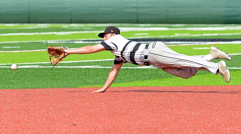 Bryant's Noah Davis dives for a ground ball hit just out of reach by Creighton Prep's Drew Jensen on Sunday, June 6, 2021 at Hunts Park in Fort Smith during the championship game in the Katzer tournament. (Special to NWA Democrat Gazette/Brian Sanderford)