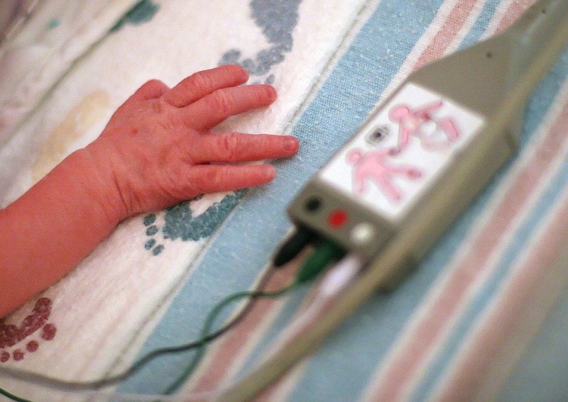 Arkansas Democrat-Gazette/DAN HALE -  An infant rests in the neonatal intensive care unit at Northwest Health in Springdale on Tuesday afternoon.  9-12-06