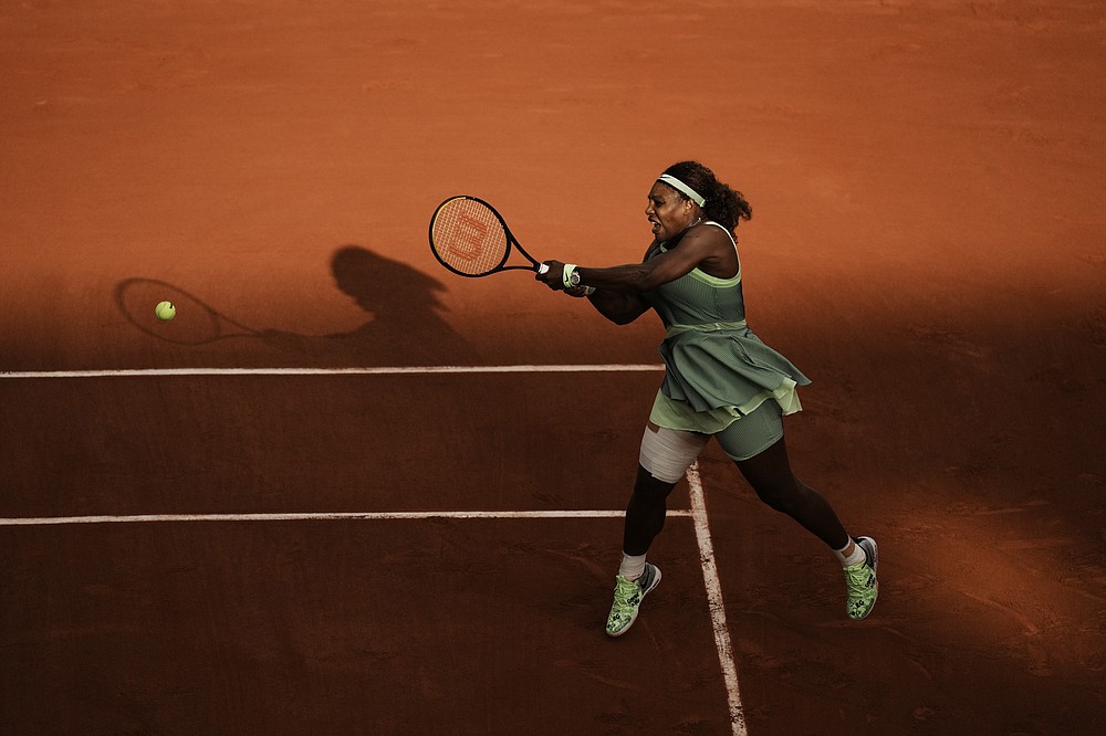 United States Serena Williams plays a return to Kazakhstan's Elena Rybakina during their fourth round match on day 8, of the French Open tennis tournament at Roland Garros in Paris, France, Sunday, June 6, 2021. (AP Photo/Thibault Camus)