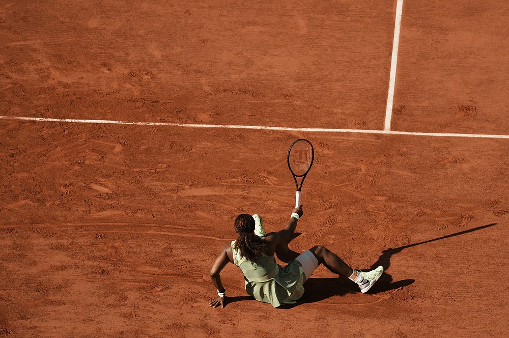 United States Serena Williams slips on the clay court as she attempts to play a return to Kazakhstan's Elena Rybakina during their fourth round match on day 8, of the French Open tennis tournament at Roland Garros in Paris, France, Sunday, June 6, 2021. (AP Photo/Thibault Camus)