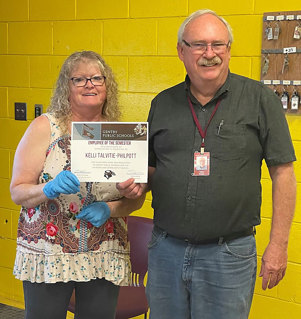 SUBMITTED
Kelli Talvitie-Philpott receives an employee of the semester award from Clyde Backer. (She was wearing rubber gloves because she had just served ice cream.)