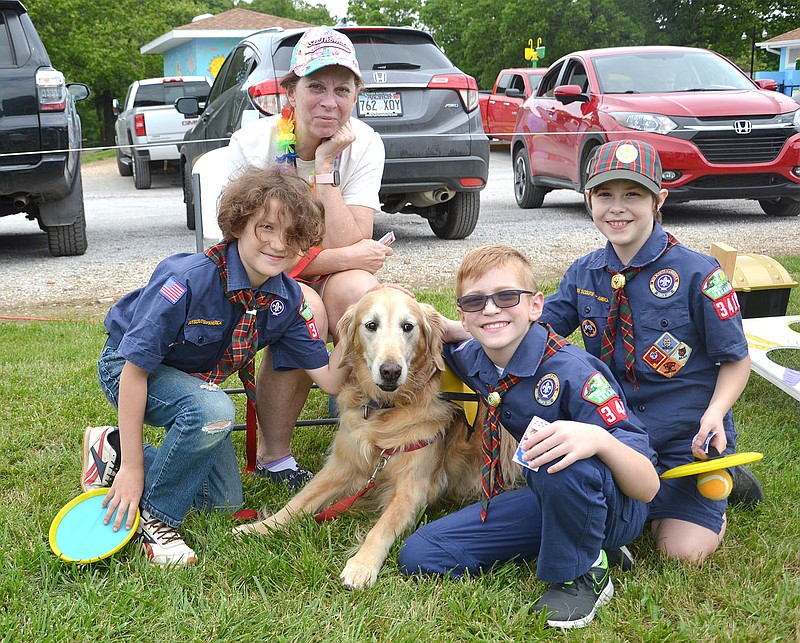 Sheila Day and her golden were a favorite for these young Scouts at the Pea Ridge Community Library Summer Reading Kickoff bash Saturday, June 5.
