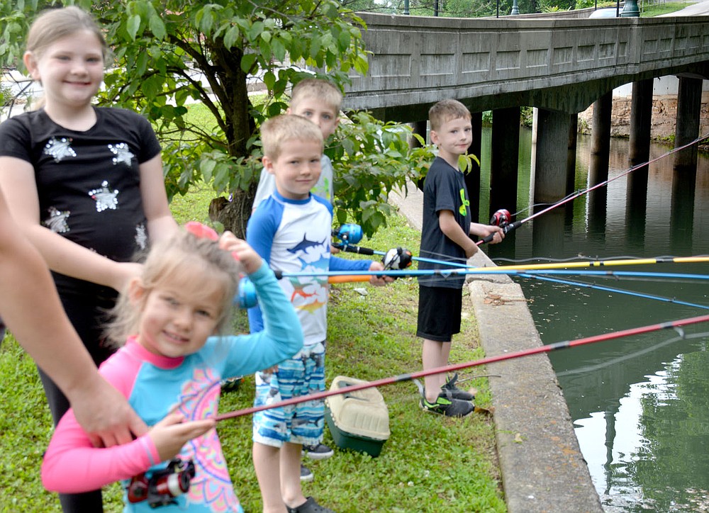 Marc Hayot/Herald-Leader Natalee Fullerton, 4 scratches her head as Adyson Lux (left), 8, Liam Fullerton, 6, Brantley Lux, 5, and Diesel Lux, 5 smile at the camera.