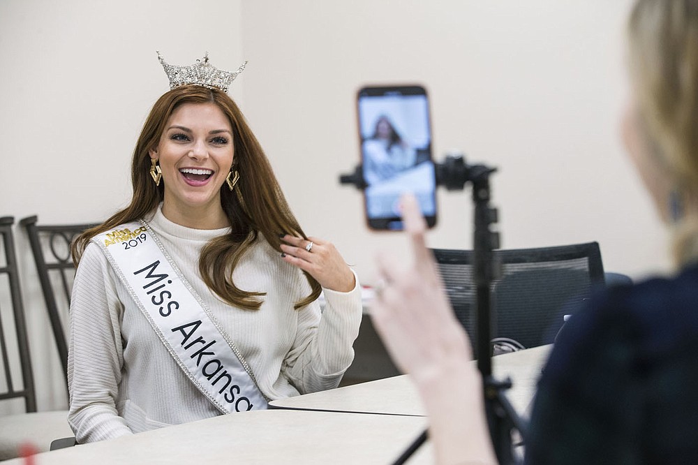 Miss Arkansas Darynne Dahlem records messages Tuesday, Jan. 21, 2020, at the Community Clinic in Fayetteville. The videos will be used to promote awareness on the Community Clinic's social media platforms.
Dahlem, who plans to go to medical school to be a pediatrician, visited the Community Clinic location to learn about the medication assisted treatment program that began in March. Abbie Luzius, community development director with the clinic, said the program employs a wholistic approach to treating opioid addiction beyond just using medication.
Dahlem described the partnership as a natural fit with her 'Know who you are' platform that fights addiction by encouraging people to resist peer pressure.
Check out nwaonline.com/200122Daily/ for today’s photo gallery.
(NWA Democrat-Gazette/Ben Goff)