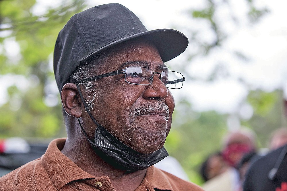 Buena Vista farmer Sylvester Slaughter gets emotional when detailing the discriminatory loan practices of the USDA that hurt Black farmers at a gathering on Tuesday, May 4, 2021, with U.S. Sen. Rev. Raphael Warnock in Byromville, Ga. (Riley Bunch/The Daily Times via AP)