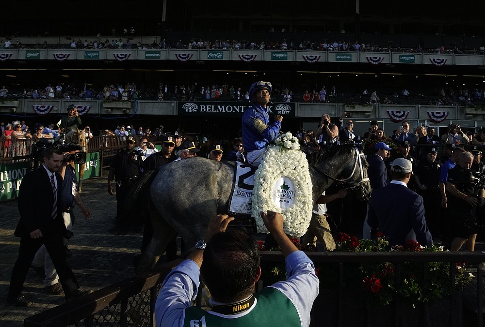 Essential Quality (2), with jockey Luis Saez up, walks to the winner's circle after winning the 153rd running of the Belmont Stakes horse race, Saturday, June 5, 2021, at Belmont Park in Elmont, N.Y. (AP Photo/Eduardo Munoz Alvarez)