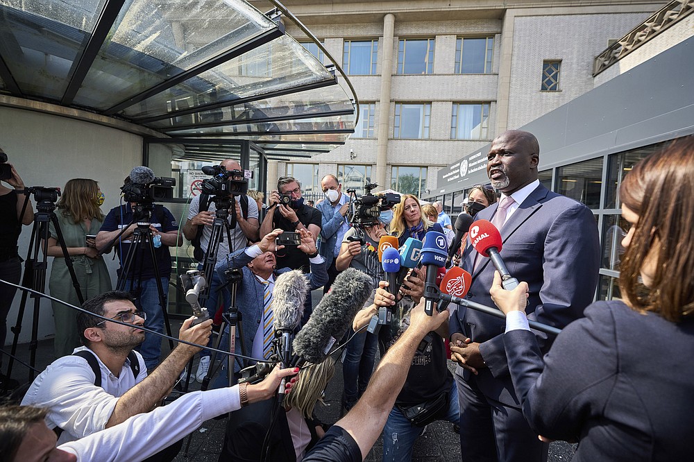 Abubacarr Tambadou, the Registrar of the International Residual Mechanism for Criminal Tribunals, speaks to journalists outside the court in The Hague, Netherlands, Tuesday, June 8, 2021. U.N. appeals judges on Tuesday upheld the conviction of former Bosnian Serb military chief Ratko Mladic for genocide and other offenses during Bosnia's 1992-95 war and confirmed his life sentence. (AP Photo/Phil Nijhuis)