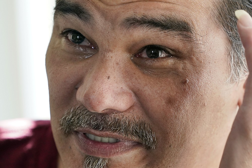 With tears welling in his eyes, Leroy Pascubillo talks with a visitor about his journey in regaining custody of his young daughter, May 10, 2021, in Seattle. Pascubillo, who had used drugs for the better part of four decades, was in a court-ordered in-patient drug rehab program when the pandemic first hit. (AP Photo/Elaine Thompson)
