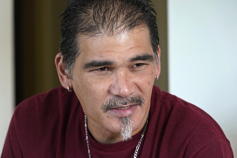 Leroy Pascubillo talks with a visitor about his journey in regaining custody of his young daughter, May 10, 2021, in Seattle. Pascubillo, who had used drugs for the better part of four decades, was in a court-ordered in-patient drug rehab program when the pandemic first hit. (AP Photo/Elaine Thompson)
