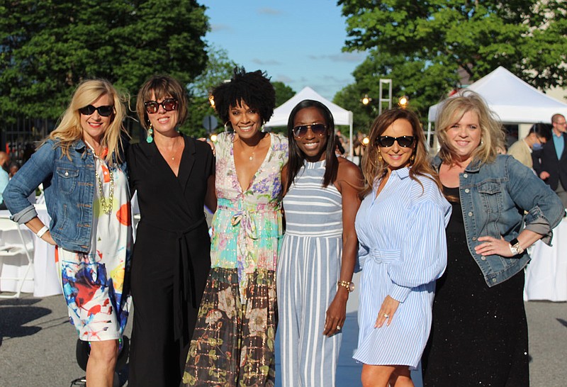 Jennifer Yuracheck (from left), Jody Dilday, Danyelle Musselman, Dahlia Sategna, Tareneh Manning and Anne Jackson attend the Interform Fashion runway show on May 29 on Emma Avenue in Springdale. The fashion show was part of the day's events to launch Interform | Assembly, a month-long multi-media experience.
(NWA Democrat-Gazette/Carin Schoppmeyer)