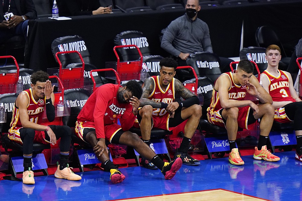 Atlanta Hawks' players watch from the bench during the final seconds of Game 2 in a second-round NBA basketball playoff series against the Philadelphia 76ers, Tuesday, June 8, 2021, in Philadelphia. (AP Photo/Matt Slocum)