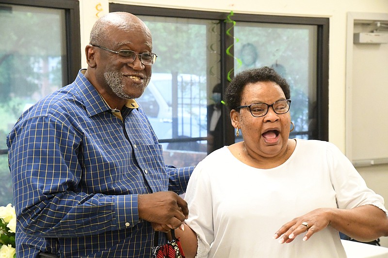 Richard Herrington Jr., left, celebrates winning the 2020 Charles L. Farris Award with his wife, Debbie Herrington, on Tuesday. - Photo by Tanner Newton of The Sentinel-Record