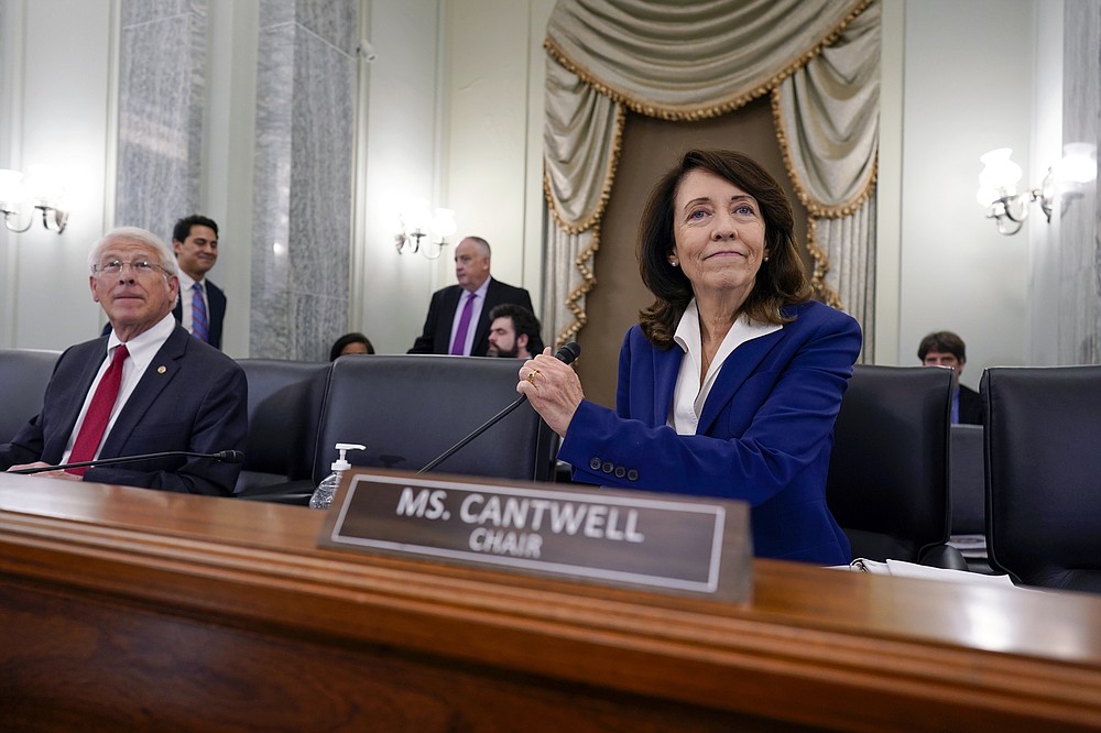 Sen. Maria Cantwell, D-Wash., chair of the Senate Commerce, Science, and Transportation Committee, joined at left by Sen. Roger Wicker, R-Miss., the ranking member, holds a hearing on student athlete compensation and federal legislative proposals to enable athletes participating in collegiate sports to monetize their name, image, and likeness, at the Capitol in Washington, Wednesday, June 9, 2021. (AP Photo/J. Scott Applewhite)