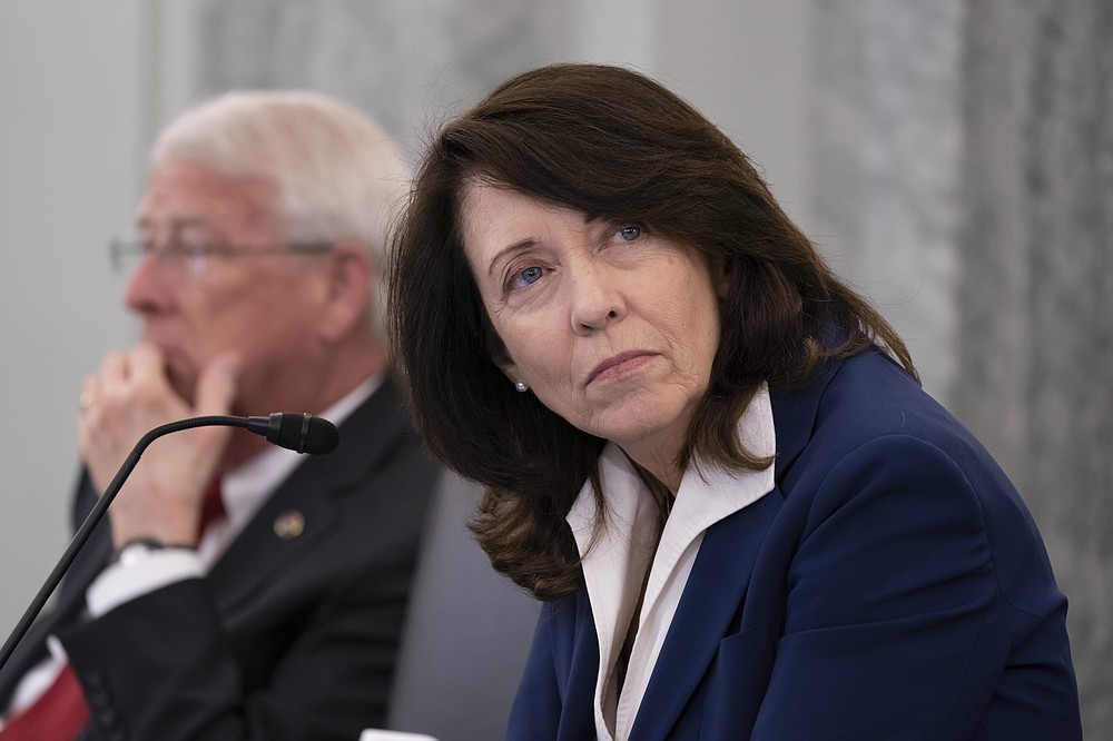 Sen. Maria Cantwell, D-Wash., chair of the Senate Commerce, Science, and Transportation Committee, joined at left by Sen. Roger Wicker, R-Miss., holds a hearing on student athlete compensation and federal legislative proposals to enable athletes participating in collegiate sports to monetize their name, image, and likeness, at the Capitol in Washington, Wednesday, June 9, 2021. (AP Photo/J. Scott Applewhite)