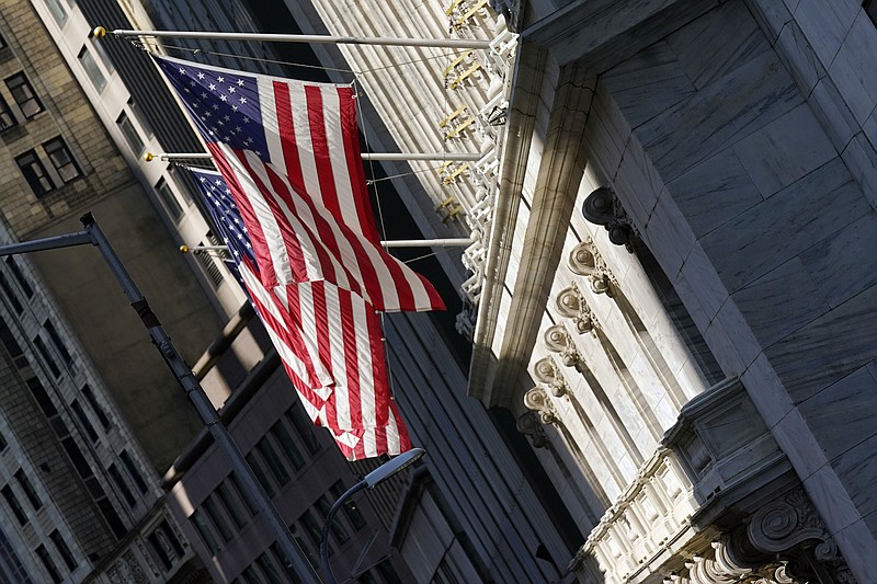 U.S. flags fly from the facade of the New York Stock Exchange, Monday, June 7, 2021. Stocks are opening mostly higher on Wall Street as gains for Big Tech companies offset weakness in banks and other parts of the market. The S&P 500 edged up 0.1% in the early going Wednesday, June 9.  (AP Photo/Richard Drew)