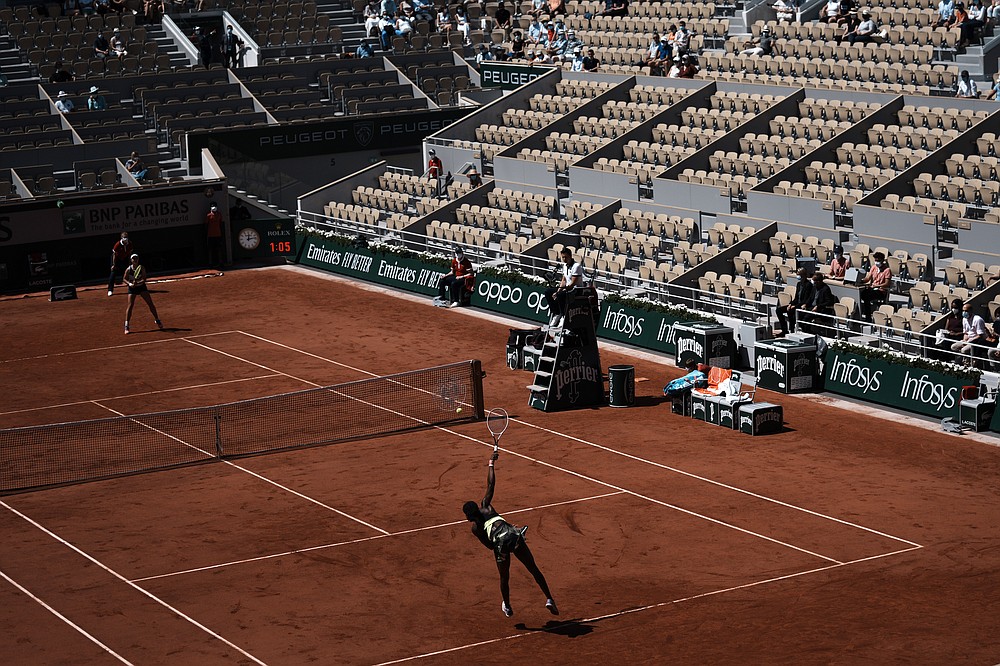 United States's Coco Gauff serves the ball to Czech Republic's Barbora Krejcikova during their quarterfinal match of the French Open tennis tournament at the Roland Garros stadium Wednesday, June 9, 2021 in Paris. (AP Photo/Thibault Camus)