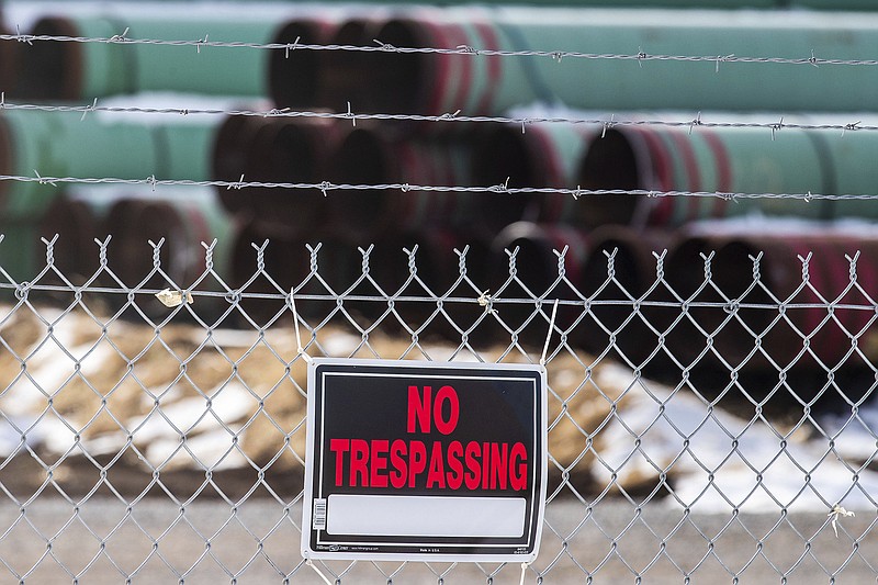 FILE - In this Dec. 18, 2020, file photo, pipes to be used for the Keystone XL pipeline are stored in a field near Dorchester, Neb. Calgary-based TC Energy, sponsor of the Keystone XL crude oil pipeline, said Wednesday, June 9, 2021, that it was pulling the plug on the contentious project after Canadian officials failed to convince President Joe Biden to reverse its cancellation of its permit on the day he took office. (Chris Machian/Omaha World-Herald via AP, FIle))