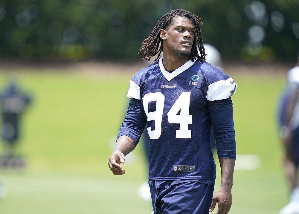 In this photo made Tuesday, June 8, 2021, Dallas Cowboys defensive end Randy Gregory (94) walks the field during an NFL football team practice, in Frisco, Texas. Gregory isn't ashamed of a suspension-filled past that nearly derailed his NFL career, just maybe a little tired of it being the focus of his story. (AP Photo/LM Otero)
