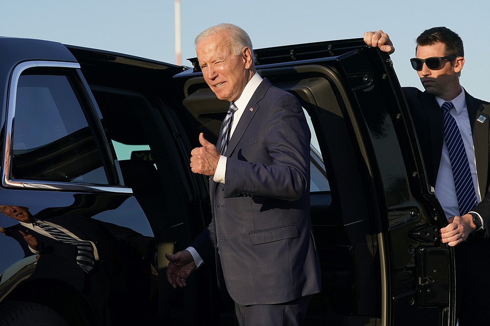 President Joe Biden steps into a motorcade vehicle after arriving at RAF Mildenhall in Suffolk, England, Wednesday, June 9, 2021. (AP Photo/Patrick Semansky)