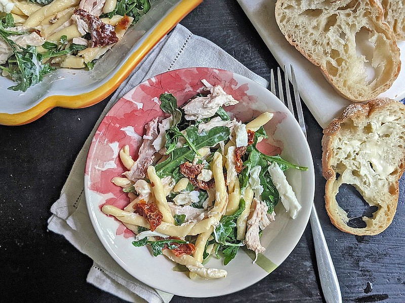 A creamy lemon aioli adds some zing to this pasta salad made with sun-dried tomatoes, arugula and shredded chicken. (TNS/Pittsburgh Post-Gazette/Gretchen McKay)