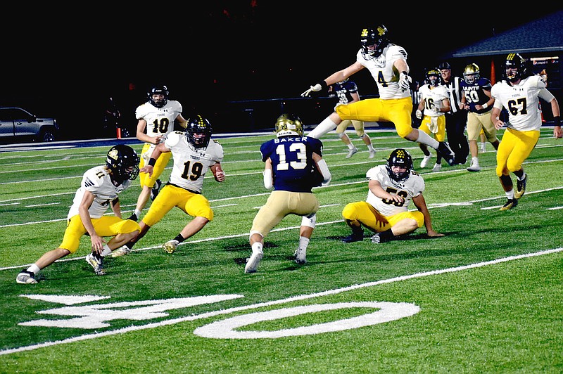 MARK HUMPHREY  ENTERPRISE-LEADER/Prairie Grove defenders take all available routes including going aerial when pursuing the football. Last week the Tigers were notified in a surprise announcement by the Arkansas Activities Association that they will be bumped up to the 5A Classification for the 2022-2024 school years.