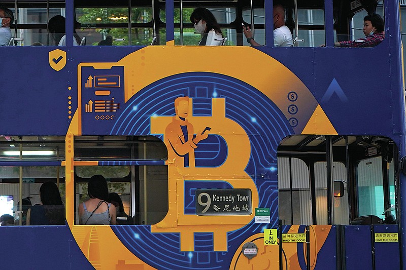 An advertisement for Bitcoin, one of the cryptocurrencies, is displayed on a tram in Hong Kong on Wednesday, May 12, 2021.