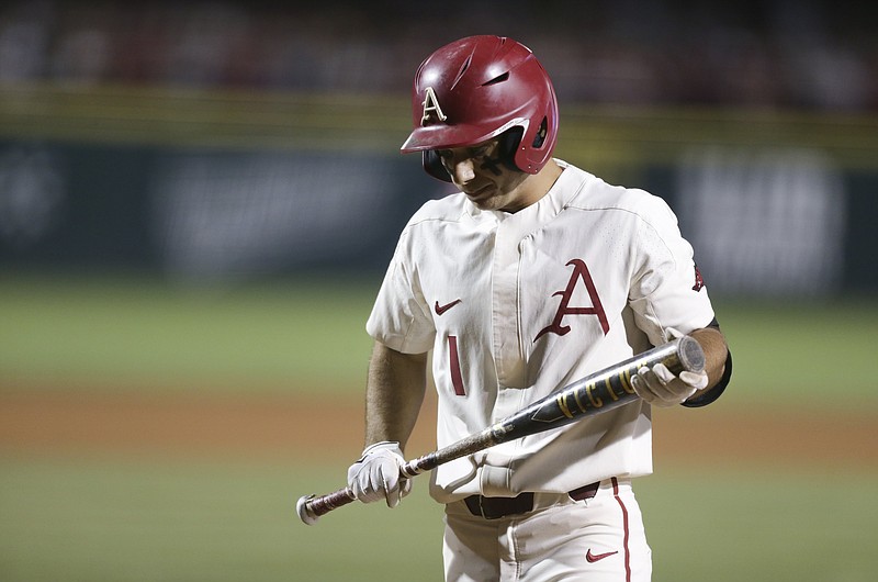 Arkansas infielder Robert Moore (1) heads to the dugout after striking out Sunday during the fourth inning against Nebraska in the NCAA Fayetteville Regional at Baum-Walker Stadium in Fayetteville. - Photo by Charlie Kaijo of NWA Democrat-Gazette