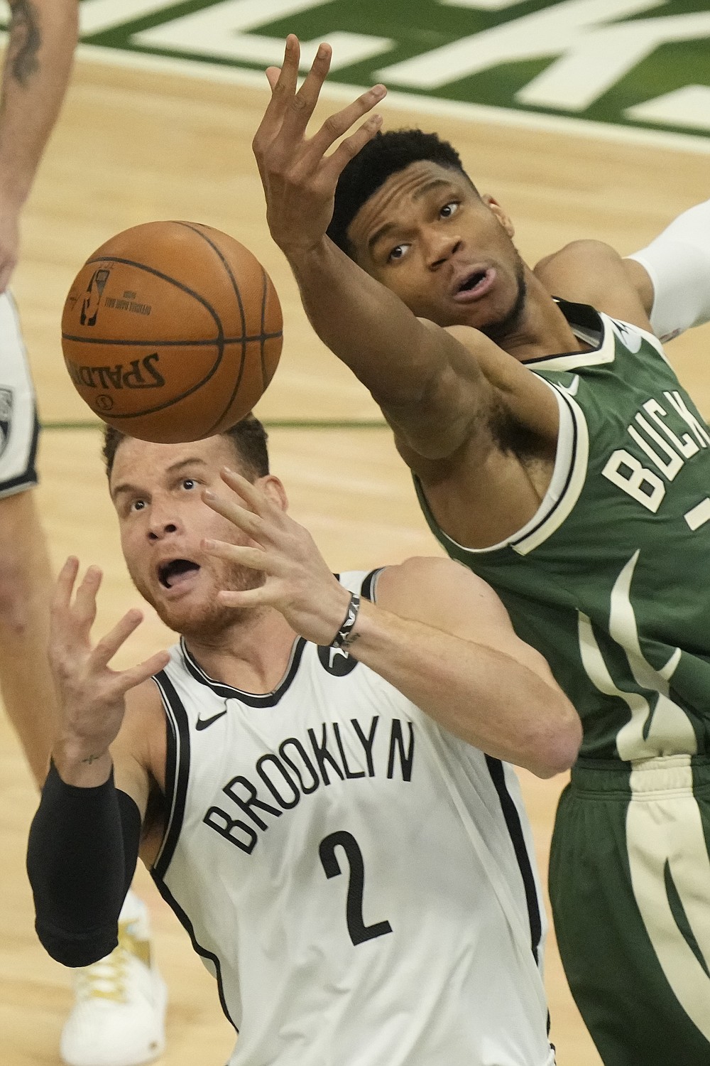 Brooklyn Nets' Blake Griffin and Milwaukee Bucks' Giannis Antetokounmpo go after a loose ball during the first half of Game 3 of the NBA Eastern Conference basketball semifinals game Thursday, June 10, 2021, in Milwaukee. (AP Photo/Morry Gash)
