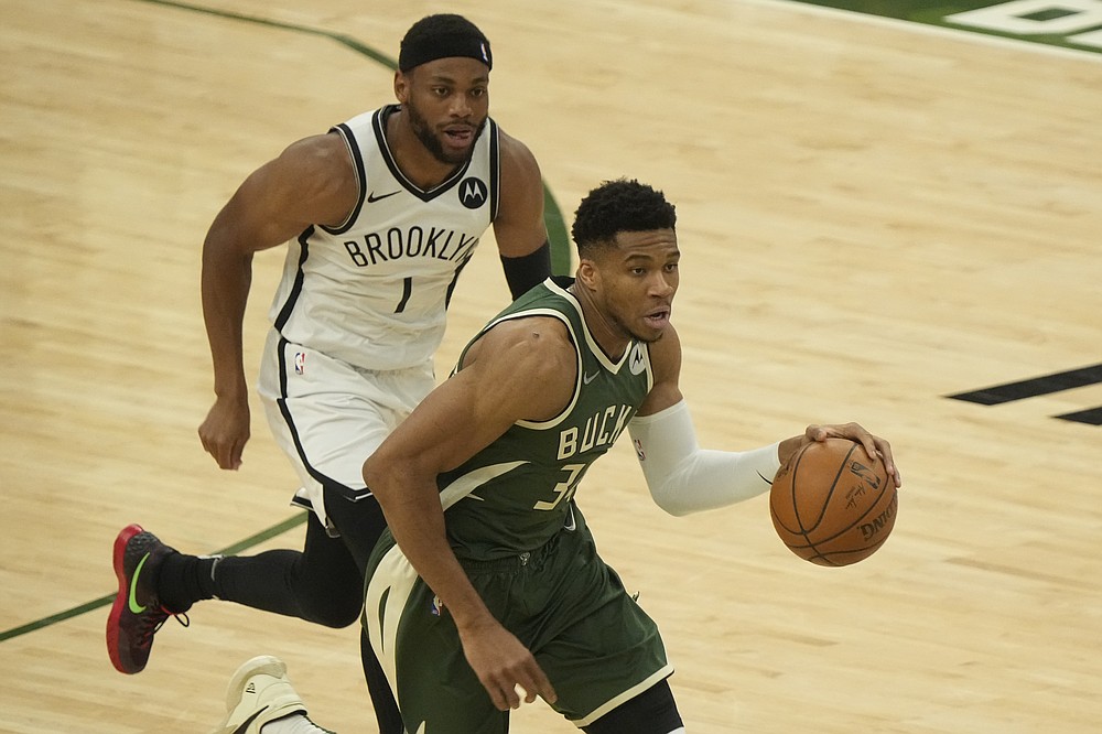 Milwaukee Bucks' Giannis Antetokounmpo drives past Brooklyn Nets' Bruce Brown during the first half of Game 3 of the NBA Eastern Conference basketball semifinals game Thursday, June 10, 2021, in Milwaukee. (AP Photo/Morry Gash)